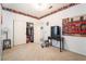 A bedroom featuring neutral carpet, ample closet space and a mini refrigerator at 1893 Donnington Ct, Las Vegas, NV 89123
