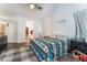 Comfortable bedroom features light walls, wood-look floors and large bedside dresser at 1893 Donnington Ct, Las Vegas, NV 89123
