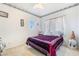 Cozy bedroom featuring decorative accents and a comfortable bed with a patterned purple comforter at 1893 Donnington Ct, Las Vegas, NV 89123