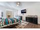 Cozy bedroom featuring a ceiling fan, and plaid rug on wood flooring at 1893 Donnington Ct, Las Vegas, NV 89123