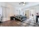 Bright bedroom featuring light walls, wood-look floors, and sliding glass doors at 1893 Donnington Ct, Las Vegas, NV 89123
