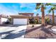 Inviting single-Gathering home with a well-maintained front yard and desert landscaping at 1893 Donnington Ct, Las Vegas, NV 89123