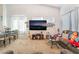 Cozy living room and dining area combo with a large television at 1893 Donnington Ct, Las Vegas, NV 89123