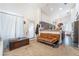 Cozy living room featuring wood flooring, a futon, and natural light at 1893 Donnington Ct, Las Vegas, NV 89123