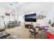 Cozy living room and dining area combo with a large television at 1893 Donnington Ct, Las Vegas, NV 89123