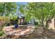 Charming backyard featuring a stone patio, a gazebo, and plenty of lush greenery at 2024 Riva Del Garda Pl, Las Vegas, NV 89134