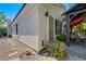 Exterior of the home showing the side of the house with a security door leading to the backyard at 2024 Riva Del Garda Pl, Las Vegas, NV 89134
