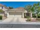 Charming single-story home with desert landscaping and a two-car garage at 2024 Riva Del Garda Pl, Las Vegas, NV 89134