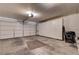 Spacious garage with white cabinets for organized storage at 2024 Riva Del Garda Pl, Las Vegas, NV 89134