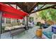 Inviting gazebo area with outdoor furniture, a porch swing, and colorful flowers for relaxation at 2024 Riva Del Garda Pl, Las Vegas, NV 89134