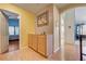 Hallway with wood floors and a cabinet, leading to other rooms at 2024 Riva Del Garda Pl, Las Vegas, NV 89134