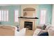 Bright living room with a fireplace and well-lit with plantation shutters at 2024 Riva Del Garda Pl, Las Vegas, NV 89134