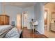 Bright main bedroom with a vanity, hardwood floor, and adjoining bathroom at 2024 Riva Del Garda Pl, Las Vegas, NV 89134
