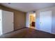 Neutral bedroom features a bathroom with a vanity and mirror, offering a clean and functional space at 2300 E Silverado Ranch Blvd # 1180, Las Vegas, NV 89183
