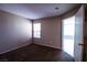 Neutral bedroom features a window with blinds allowing for natural light, creating a cozy atmosphere at 2300 E Silverado Ranch Blvd # 1180, Las Vegas, NV 89183