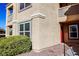 Multi-level beige home with manicured shrubs and front door at 2300 E Silverado Ranch Blvd # 1180, Las Vegas, NV 89183