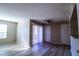 Bright and sunny room with laminate flooring, featuring natural light, and ceiling fan at 2300 E Silverado Ranch Blvd # 1180, Las Vegas, NV 89183