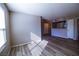 Open-plan living area featuring wood floors and a view through to the kitchen at 2300 E Silverado Ranch Blvd # 1180, Las Vegas, NV 89183