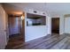 Bright living room with stylish wood floors and a kitchen pass through counter, great for entertaining at 2300 E Silverado Ranch Blvd # 1180, Las Vegas, NV 89183