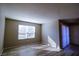 Bright and sunny room with laminate flooring, featuring natural light, and sliding glass door at 2300 E Silverado Ranch Blvd # 1180, Las Vegas, NV 89183