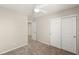 Bedroom with neutral carpet, ceiling fan with light, and a closet with sliding doors at 2409 Bellinzona Pl, Henderson, NV 89044