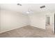 Spacious bedroom with neutral walls, neutral carpet, ceiling fan, and ensuite bathroom at 2409 Bellinzona Pl, Henderson, NV 89044