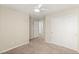 Bedroom featuring neutral walls, carpet, closet with sliding doors, and ceiling fan at 2409 Bellinzona Pl, Henderson, NV 89044