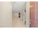 Inviting entryway showcasing tile flooring, stairs, and open sightlines to the kitchen and living areas at 2409 Bellinzona Pl, Henderson, NV 89044