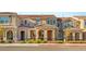 Charming townhome featuring a tiled roof, neutral stucco, and well-maintained landscaping in a cozy neighborhood at 2409 Bellinzona Pl, Henderson, NV 89044