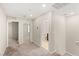 Hallway features access to bedrooms and bathrooms, and neutral carpet and walls at 2409 Bellinzona Pl, Henderson, NV 89044