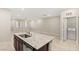 Open kitchen design features granite countertops, and stainless steel appliances, with adjacent laundry room at 2409 Bellinzona Pl, Henderson, NV 89044