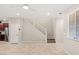 Open living area adjacent to kitchen features a staircase at 2409 Bellinzona Pl, Henderson, NV 89044