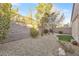 Large xeriscaped backyard featuring artificial lawn area at 2444 Gamma Ray Pl, Henderson, NV 89044