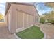 Back of house featuring an enclosed patio and tidy, xeriscaped backyard at 2444 Gamma Ray Pl, Henderson, NV 89044
