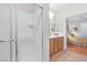 Clean bathroom featuring a shower and a view into the main bedroom at 2444 Gamma Ray Pl, Henderson, NV 89044