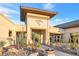 Solera community clubhouse entrance featuring desert landscaping with native trees and rock ground cover at 2444 Gamma Ray Pl, Henderson, NV 89044
