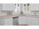 Kitchen featuring a stainless steel sink, white cabinets, and modern fixtures at 2444 Gamma Ray Pl, Henderson, NV 89044