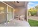 Charming outdoor patio with comfortable seating and views of the well-kept yard at 2444 Gamma Ray Pl, Henderson, NV 89044