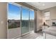 A bedroom balcony with large sliding glass doors providing mountain views at 2583 Hazelburn Ave, Henderson, NV 89044