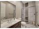 This contemporary bathroom has tiled walls and a glass door shower at 2583 Hazelburn Ave, Henderson, NV 89044