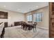 Cozy dining room with natural light, a wooden table, and seamlessly integrated with the kitchen at 2583 Hazelburn Ave, Henderson, NV 89044