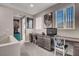 Comfortable home office space with built in desk and storage beneath two bright windows, decorated with movie posters at 2583 Hazelburn Ave, Henderson, NV 89044