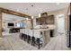 A modern kitchen island with seating overlooks the spacious living area and offers ample counter space at 2583 Hazelburn Ave, Henderson, NV 89044