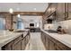Modern kitchen features a large island with an open layout and stainless steel appliances at 2583 Hazelburn Ave, Henderson, NV 89044