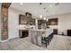 This modern kitchen is complete with an island, pendant lighting, and stainless steel appliances at 2583 Hazelburn Ave, Henderson, NV 89044