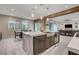 This kitchen includes a spacious island with seating that opens up to the living and dining areas at 2583 Hazelburn Ave, Henderson, NV 89044