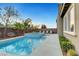Sparkling pool and jacuzzi surrounded by palm trees and lounge chairs, ideal for outdoor relaxation at 2583 Hazelburn Ave, Henderson, NV 89044