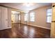 Spacious bedroom with hardwood flooring, a mirrored closet, and lots of natural light from dual windows at 2611 S Durango Dr # 102, Las Vegas, NV 89117