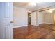 Empty bedroom with hardwood floors and large mirrored closet ready for your personal touches at 2611 S Durango Dr # 102, Las Vegas, NV 89117