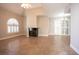 Spacious living room with tile floors, modern fireplace, and abundant natural light from the large windows at 2611 S Durango Dr # 102, Las Vegas, NV 89117